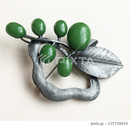 Womens vintage brooch handmade look on fabric background Womens vintage brooch handmade look on fabric background 125730914