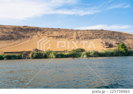 Nile River Landscape near Aswan Dam, Egypt. 125730983