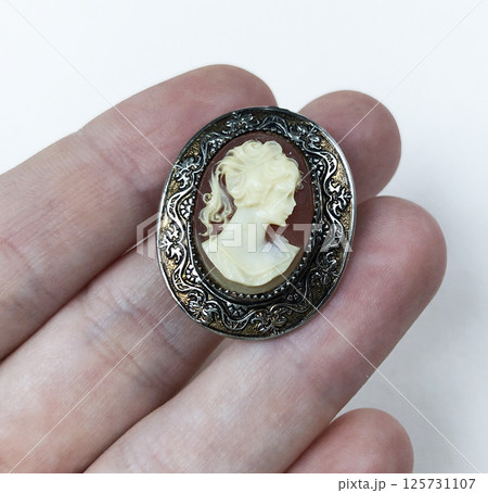 Womens vintage brooch laid on soft background fashion photo 125731107