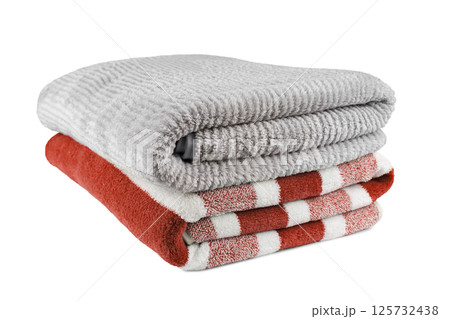 Soft fluffy striped grey and red bath towels folded in stack isolated on white background 125732438
