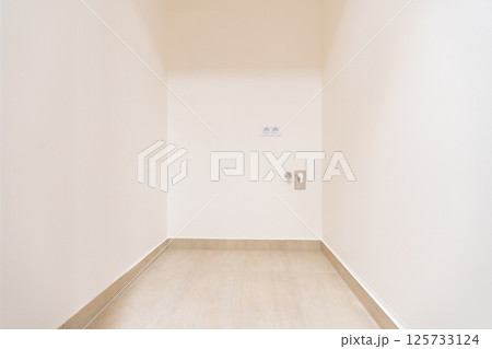 Utility corner in modern apartment prepared for washing machine installation 125733124