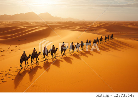 In desert, a camel caravan passes through sand dunes AI Generative 125733548
