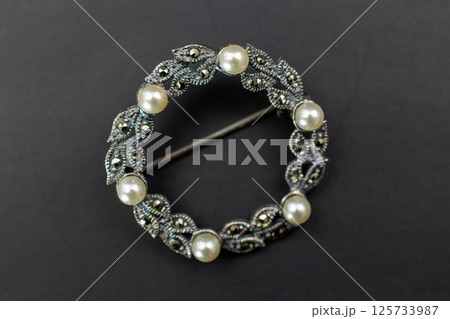 Brooch on beige surface floral detail vintage for women Brooch on beige surface floral detail vintage for women 125733987