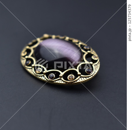 Romantic brooch on linen surface vintage accessory photo Romantic brooch on linen surface vintage accessory photo 125734379