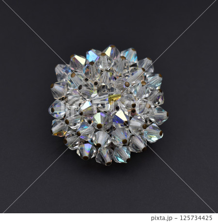 Flat lay image brooch vintage charm accessory for women Flat lay image brooch vintage charm accessory for women 125734425