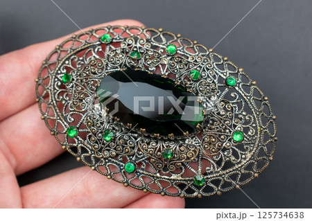 Brooch floral design vintage style laid flat photo Brooch floral design vintage style laid flat photo 125734638