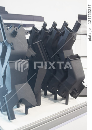 Model printed on 3D printer from polyamide powder close-up. Detailed prototype created on 3D printer from plastic powder. 3D printing additive powder technology, Multi Jet Fusion MJF technology 125735287