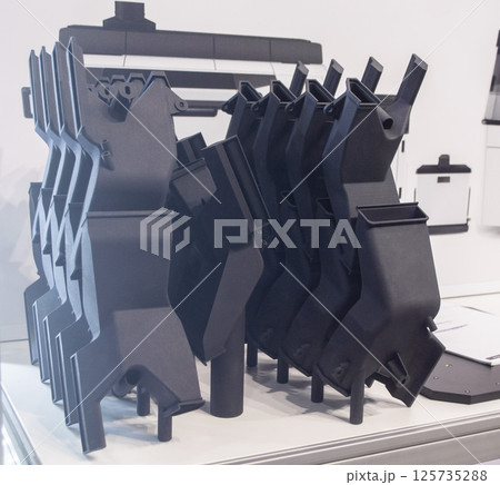 Model printed on 3D printer from polyamide powder close-up. Detailed prototype created on 3D printer from plastic powder. 3D printing additive powder technology, Multi Jet Fusion MJF technology Model printed on 3D printer from polyamide powder close-up. Detailed prototype created on 3D printer from plastic powder. 3D printing additive powder technology, Multi Jet Fusion MJF technology 125735288