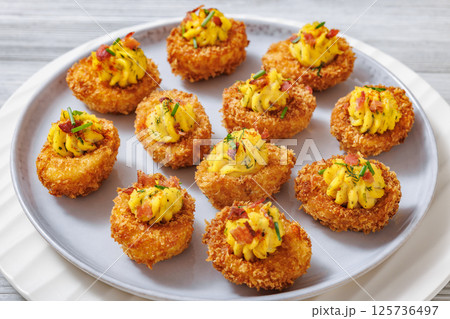 Deep fried deviled eggs with coating of panko 125736497