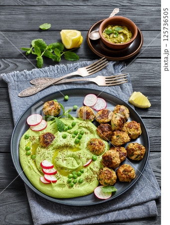 chicken broccoli meatballs with green pea hummus 125736505