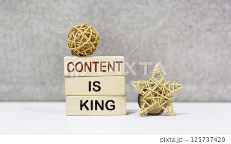 A stack of wooden blocks with writing on them CONTENT IS KING 125737429