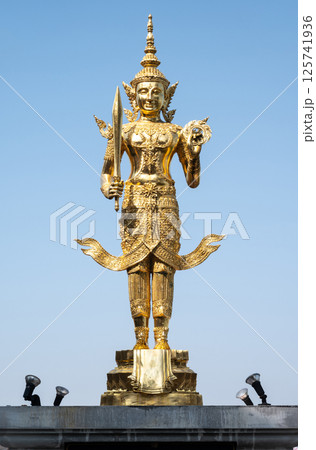 Beautiful statue of Phra Siam Devadhiraj the guardian angel of Thailand situated on the hill in Wat phra that pha ngao temple, Chiang Rai province of Thailand. 125741936