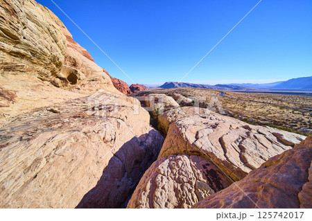 Sunlit Sandstone Formations in Red Rock Canyon Aerial Perspective Sunlit Sandstone Formations in Red Rock Canyon Aerial Perspective 125742017