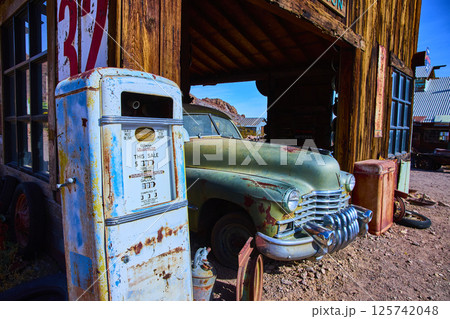 Vintage Gas Pump and Classic Car in Desert Ghost Town Eye-Level View 125742048