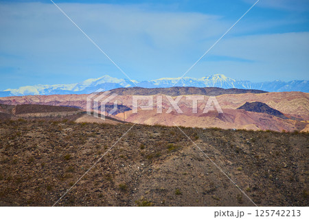 Desert Hills and Snowy Peaks in Boulder City Nevada Eye-Level View 125742213