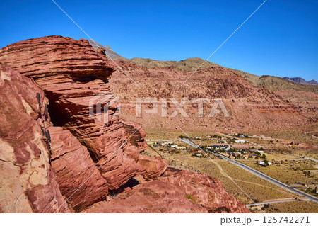 Rugged Red Rock Desert and Rural Settlement Aerial 125742271