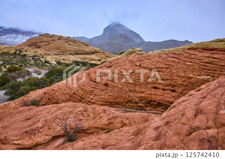 Red Rock Canyon Sandstone Formations with Misty Turtlehead Peak in View 125742410