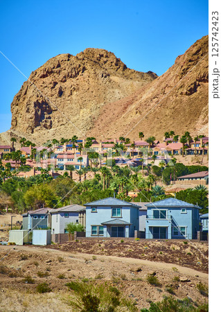 Modern Suburban Homes with Desert Mountain Backdrop Eye-Level View 125742423