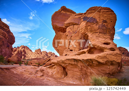 Majestic Rock Formations in Nevada Desert Under Clear Blue Sky, Eye-Level View Majestic Rock Formations in Nevada Desert Under Clear Blue Sky, Eye-Level View 125742449