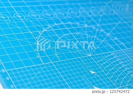 blue cutting mat board background with line and scale measure guide pattern for object art design blue cutting mat board background with line and scale measure guide pattern for object art design 125742472