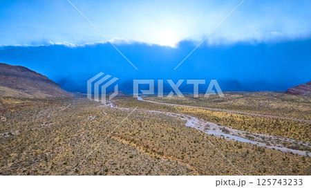 Aerial of Nevada Desert Storm Over Rugged Terrain Aerial of Nevada Desert Storm Over Rugged Terrain 125743233
