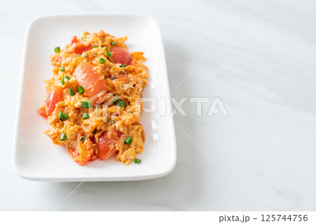 Stir-fried tomatoes with egg or Scrambled eggs with tomatoes Stir-fried tomatoes with egg or Scrambled eggs with tomatoes 125744756