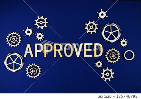 Approved alphabet letters with gears element on navy blue background Approved alphabet letters with gears element on navy blue background 125746798