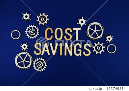 Cost Savings alphabet letters with gears element on navy blue background Cost Savings alphabet letters with gears element on navy blue background 125746814