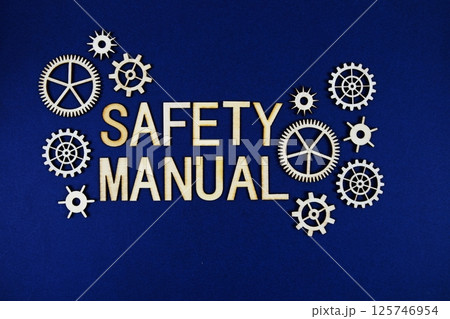 Safety Manual alphabet letters with gears element on navy blue background Safety Manual alphabet letters with gears element on navy blue background 125746954