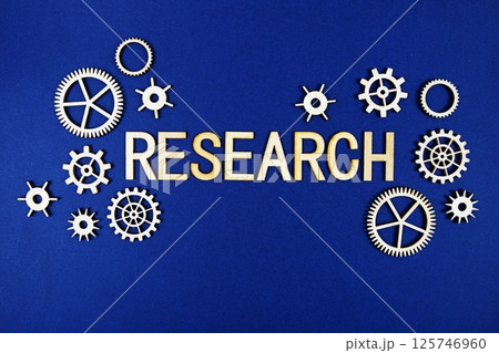 Research alphabet letters with gears element on navy blue background Research alphabet letters with gears element on navy blue background 125746960