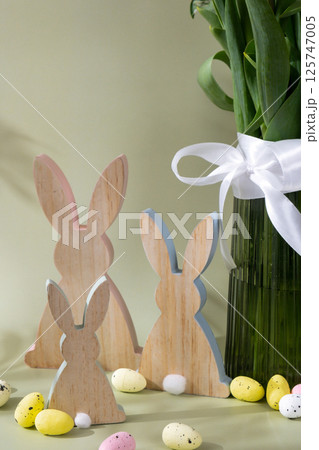 Happy EASTER composition wooden bunny eggs Fresh bouquet of colorful tulip flowers in pastel background with shadows. Minimalist design greeting card for springtime holidays. Gift for Easter. 125747005