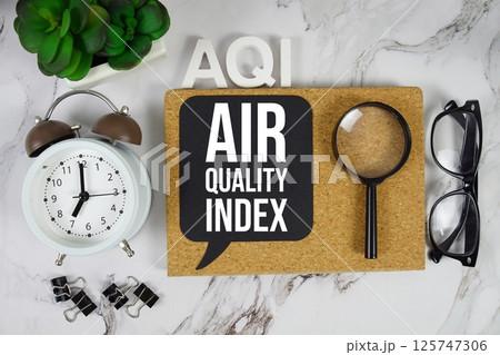 AQI - Air Quality Index acronym with alarm clock and magnifying glass, medical and healthcare concept background AQI - Air Quality Index acronym with alarm clock and magnifying glass, medical and healthcare concept background 125747306