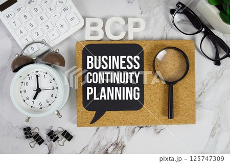 BCP - Business Continuity Planning acronym with calculator, alarm clock and magnifying glass, business concept background BCP - Business Continuity Planning acronym with calculator, alarm clock and magnifying glass, business concept background 125747309