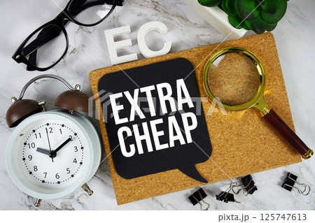 EC - Extra Cheap acronym with alarm clock and magnifying glass, business concept background EC - Extra Cheap acronym with alarm clock and magnifying glass, business concept background 125747613