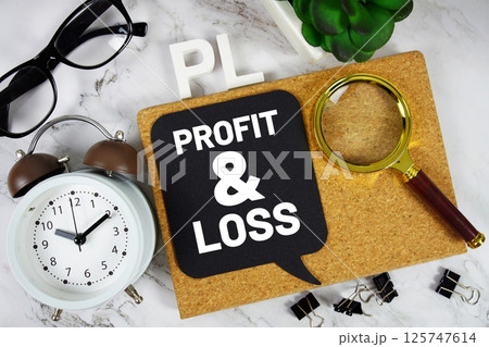 PL Profit and Loss acronym with alarm clock and magnifying glass, business concept background 125747614