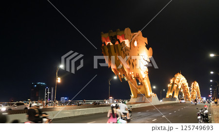 far view of dragon bridge in da nang. This modern bridge crosses the Han River at the Le Dinh Duong, Bach Dang traffic circle far view of dragon bridge in da nang. This modern bridge crosses the Han River at the Le Dinh Duong, Bach Dang traffic circle 125749693