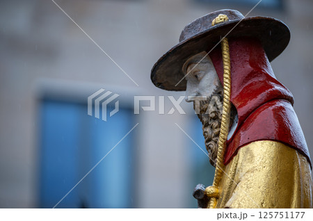 Nuremberg, Germany, August 2, 2023. Detail of one of the many statues that characterize the golden fountain in the market square. Travel destinations and tourist attractions. 125751177