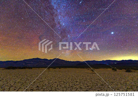 Milky Way Over Cracked Desert in Death Valley at Night Milky Way Over Cracked Desert in Death Valley at Night 125751581