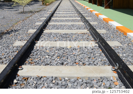Empty railroad tracks and station. Empty railroad tracks and station. 125753402