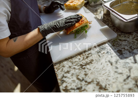 Preparing a Fresh and Delicious Sandwich with Careful Attention to Each and Every Detail 125755893