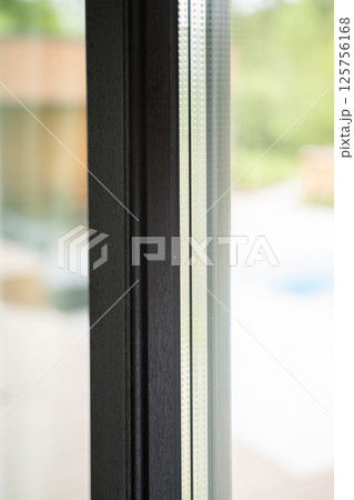 Glass window structure with perforated double glazing and shadowed interior side 125756168