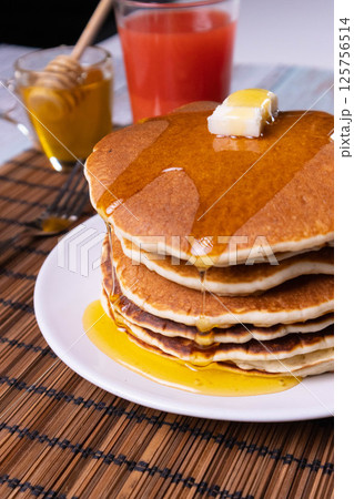 Pancake breakfast with honey and granola Pancake breakfast with honey and granola 125756514