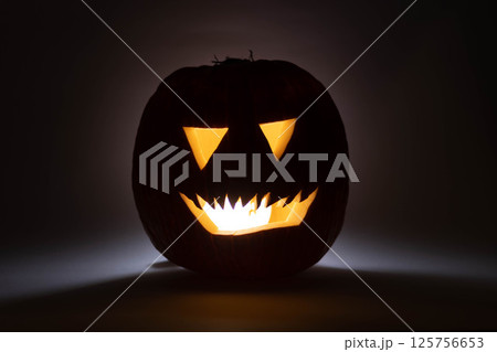 one halloween pumpkin backlit background one halloween pumpkin backlit background 125756653