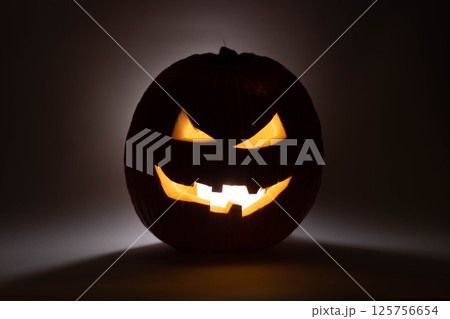 one halloween pumpkin backlit background 125756654