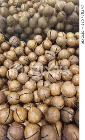 Macadamia nuts are on the counter in a supermarket. Prepared for sale. Macadamia nuts are on the counter in a supermarket. Prepared for sale. 125758247