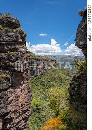 Majestic Rocky Mountains Seen from Waqrapukara, a Scenic Inca Site in Peru 125758390