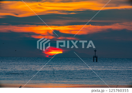 Golden Sunset Over the Ocean 125760355