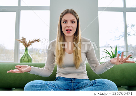 Web cam view of young woman talking looking in camera, online meeting, video call 125760471