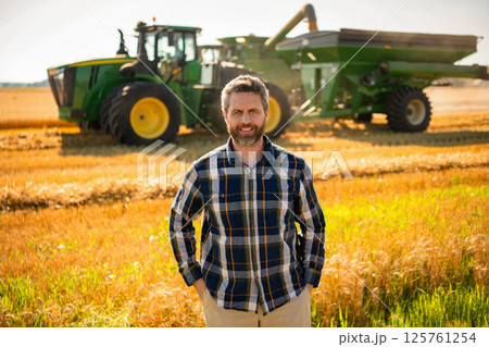 Crop harvest. Farmer check wheat. Agricultural wheat at harvest time. Countryside crop. Agronomist man harvesting at crop field. Ripe agriculture. Harvest man at field. Farmer agronomist. Farm worker Crop harvest. Farmer check wheat. Agricultural wheat at harvest time. Countryside crop. Agronomist man harvesting at crop field. Ripe agriculture. Harvest man at field. Farmer agronomist. Farm worker 125761254