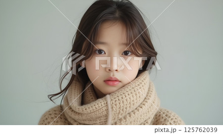 Young Asian woman wearing knitted scarf portrait 125762039